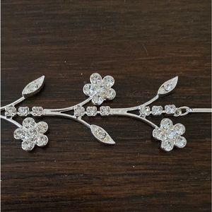 Merksamer Jewelers Silver Rhinestone flowers necklace and earrings gift set.